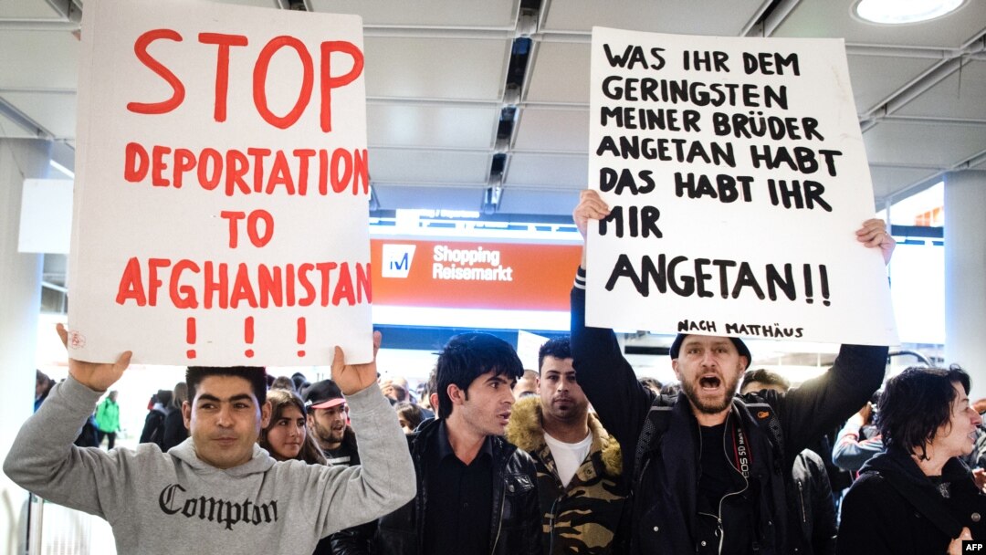 FILE - People take part in a demonstration against the deportation of some 50 Afghan refugees from Munich airport, southern Germany, Feb. 22, 2017. The Afghan government is asking the Trump administration to halt the deportation of Afghan nationals in the United States.