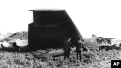 FILE - This Jan. 17, 1966, photo shows part of the wreckage of the USAF B-52 that crashed in Palomares, Spain, after a mid-air collision with a KC 135 aerial tanker during refueling. 