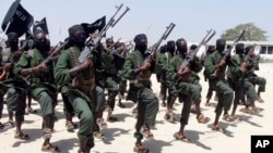 FILE - Newly trained al-Shabab fighters participate in military exercises in the Lafofe area, south of Mogadishu, in Somalia, Feb. 17, 2011. 