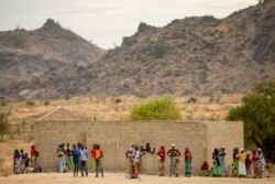 FILE - Villagers are seen gathered in Maroua, northern Cameroon, April 18, 2016. Cameroonian officials are calling on villagers to be on alert for suspected Boko Haram militants hiding near the border.
