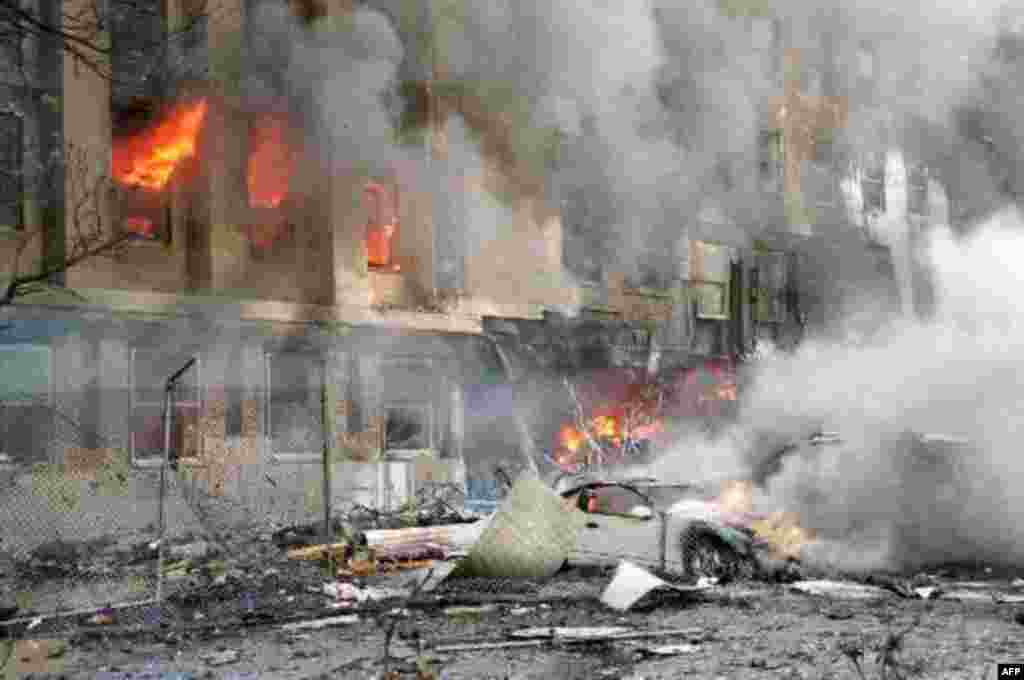 Flames and smoke pour from a building at the Pentagon Tuesday, Sept. 11, 2001, after a direct, devasting hit from an aircraft. (AP Photo/Mandatory Credit, Will Morris)