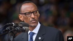 FILE - Rwandan President Paul Kagame addresses the public and dignitaries at a ceremony to mark the 20th anniversary of the Rwandan genocide, at Amahoro stadium in Kigali, Rwanda.