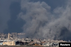 Smoke rises from an Israeli strike as the Israeli military conducts operations inside the Gaza Strip, as seen from southern Israel, on Jan. 1, 2025.