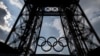 This photograph taken on June 26, 2024 shows the Olympics rings on the Eiffel Tower in Paris, on June 26, 2024. (Photo by OLYMPIA DE MAISMONT / AFP)