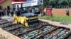 Police use a road roller to destroy bottles of illegal alcohol confiscated in Serpong, out of Jakarta, Indonesia, April 13, 2018.