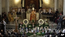 Iraqi Christians attend a mass at Our Lady of Salvation church in Baghdad, 10 Dec 2010