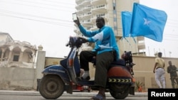 Abukar Ahmed celebrates the ruling by the International Court of Justice, largely in favor of Somalia in its dispute with Kenya, setting a sea boundary in part of the Indian Ocean in Mogadishu, Somalia, Oct. 12, 2021. 