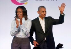 FILE - Former President Barack Obama, right, and former first lady Michelle Obama appear at the Obama Foundation Summit in Chicago, Oct. 31, 2017.