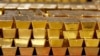 FILE - Gold bars are stacked in a vault at the United States Mint in West Point, New York, July 22, 2014. Some African nations' central banks are buying gold to bolster and protect their economies, experts say.