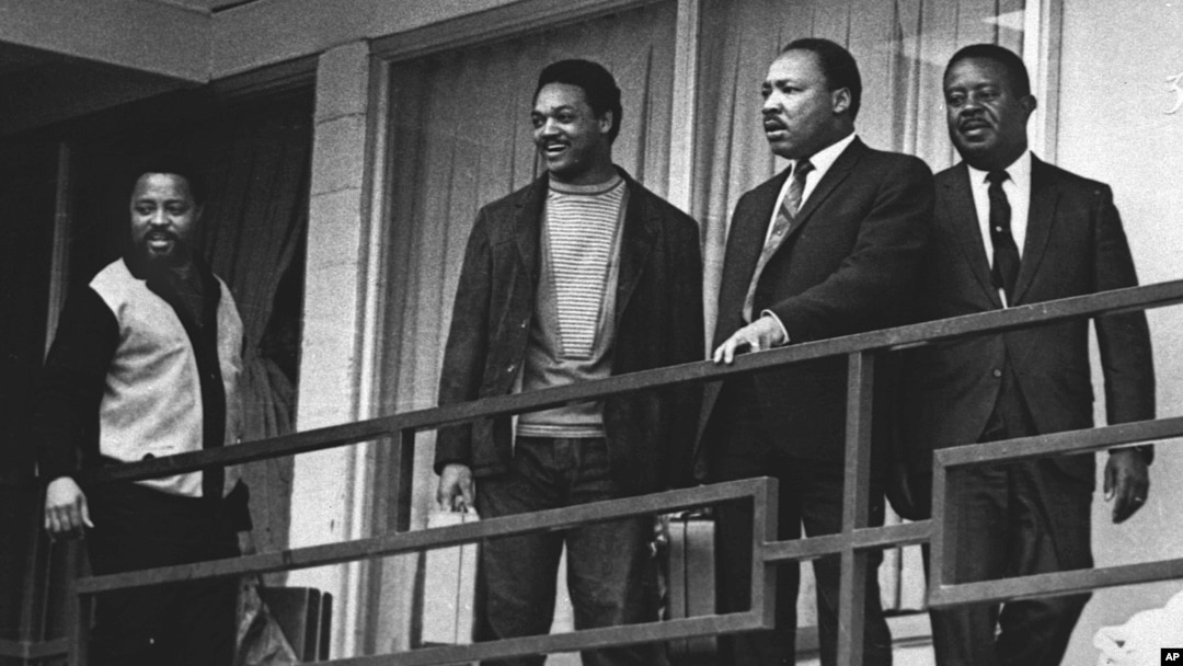FILE - The Rev. Martin Luther King Jr. stands with other civil rights leaders on the balcony of the Lorraine Motel in Memphis, Tenn., a day before he was assassinated at approximately the same place, April 3, 1968.