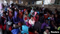 FILE - Eritrean refugees wait to get registered on arrival at the Indabaguna refugee reception and screening center in Tigrai region near the Eritrean border in Ethiopia, Feb. 9, 2016.