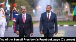 Ethiopian Prime Minister Abiy Ahmed, right, welcomes Somali President Hassan Sheikh Mohamud in Addis Ababa. 