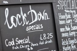 A lockdown special menu is pictured outside a fish and chip shop, as the Welsh Government is set to impose stricter lockdown measures to try to curb the spread of the coronavirus disease (COVID-19), in Llandudno, Britain, Oct. 19, 2020.