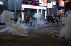 Tear gas engulf the streets of Hong Kong, Oct. 27, 2019.