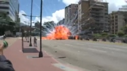 Explosion as Venezuela's National Guard Troops Pass on Caracas Street