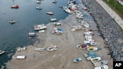 An aerial photo of Pendik port in Asian side of Istanbul, June 4, 2021, with a huge mass of marine mucilage, a thick, slimy substance made up of compounds released by marine organisms, in Turkey's Marmara Sea.