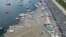 An aerial photo of Pendik port in Asian side of Istanbul, June 4, 2021, with a huge mass of marine mucilage, a thick, slimy substance made up of compounds released by marine organisms, in Turkey's Marmara Sea.