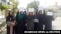 A group of women hold a street protest calling on the Taliban to protect their rights, in Kabul, Afghanistan August 17, 2021 in this still image taken from video dated August 17, 2021.