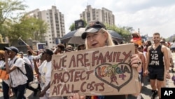 Members of the LGTBQ community take part in a Pride march in Johannesburg, Oct. 26, 2024.