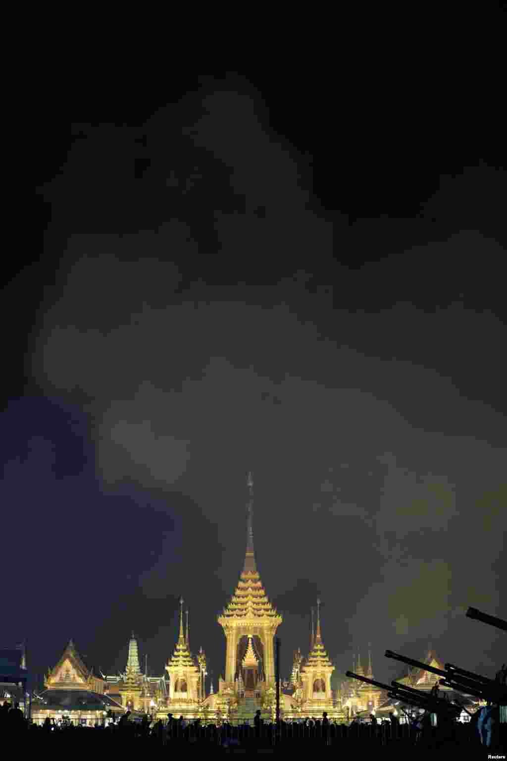 Smoke is seen at the Royal Crematorium site during the Symbolic Royal Cremation near the Grand Palace in Bangkok, Thailand, October 26, 2017. 