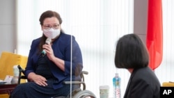 In this photo released by the Taiwan Presidential Office, U.S. Democratic Sen. Tammy Duckworth of Illinois speaks during a meeting with Taiwan President Tsai Ing-wen, right, in Taipei on June 6, 2021.