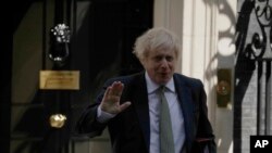 British Prime Minister Boris Johnson leaves 10 Downing Street in London, to attend his first weekly Prime Minister's Questions since recovering from coronavirus, at the Houses of Parliament, in London, May 6, 2020. 