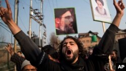 FILE - A Kashmiri Shiite Muslim shouts slogans against the Nigerian government and the detaining of their leader Ibraheem Zakzaky in Nigeria, in Srinagar, Indian-controlled Kashmir, Dec. 18, 2015. Nigeria has since ruled the group illegal.