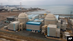 FILE - Shin-Kori No. 2 nuclear power plant, left in foreground, stands next to Shin-Kori No. 1 plant, right foreground, in Ulsan, South Korea.