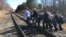 Emergency first responders and passengers from an Amtrak passenger train carrying Republican members of the U.S. Congress from Washington to a retreat in West Virginia carry one of the injured across train tracks to an ambulance after the train collided with a garbage truck in Crozet, Virginia, U.S. Jan. 31, 2018. 