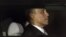President Barack Obama is seen through the window of a limo as he returns to the White House for the first time since his victory on election day, in Washington, Nov. 7, 2012. 