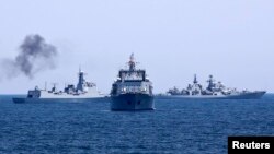 FILE - Chinese and Russian naval vessels are seen during a 2014 joint naval exercise outside Shanghai on the East China Sea.