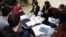 FILE - Bosnian population census officials brief pollsters before they head to work in Sarajevo, Oct. 1, 2013.