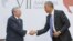 US President Barack Obama and Cuban President Raul Castro shake hands during their meeting at the Summit of the Americas in Panama City, Panama, Saturday, April 11, 2015.
