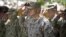 Gen. John Allen, (C), the top U.S. commander in Afghanistan, salutes before he observes Memorial Day at ISAF headquarters in Kabul, Afghanistan, May 28, 2012. 