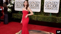 Emmy Rossum arrives at the 73rd annual Golden Globe Awards on Jan. 10, 2016, at the Beverly Hilton Hotel in Beverly Hills, Calif. 