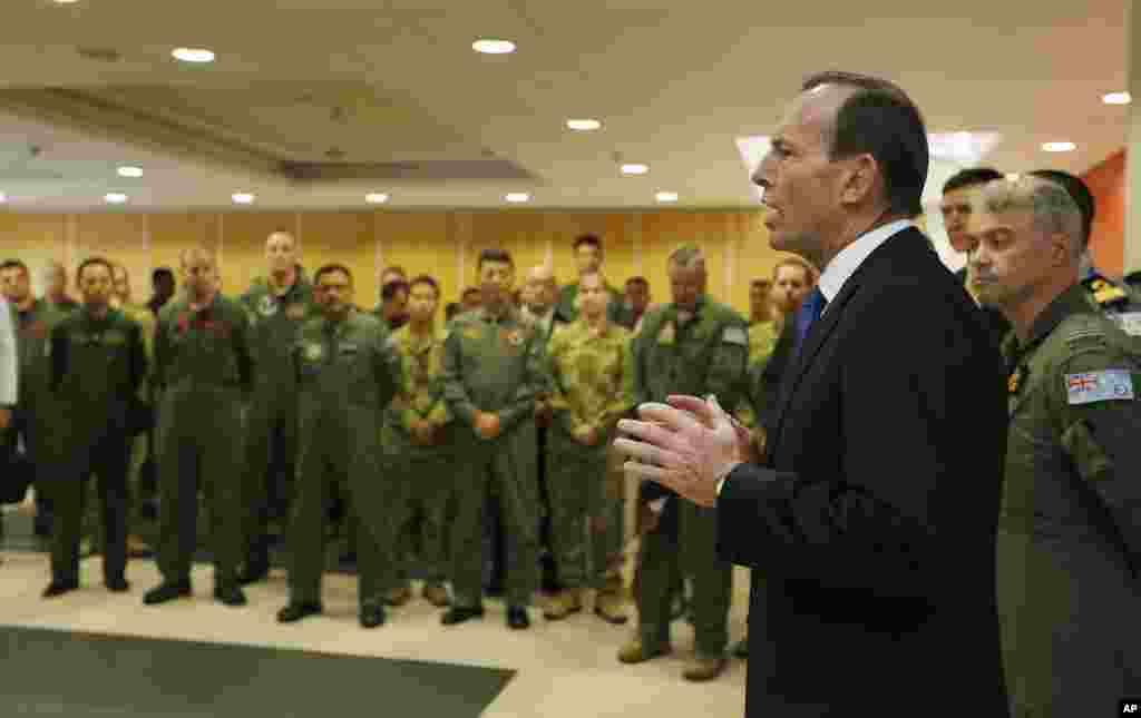 Australian Prime Minister Tony Abbott addresses the international forces currently based in Perth searching for Flight MH370 during his visit to RAAF Base Pearce, March 31, 2014.