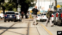 Law enforcement officers respond to the scene of a shooting at a Santa Clara Valley Transportation Authority (VTA) facility on Wednesday, May 26, 2021, in San Jose, California.