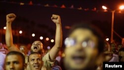 Supporters of deposed Egyptian president Mohamed Morsi shout anti-army slogans during a protest in Cairo July 11, 2013.