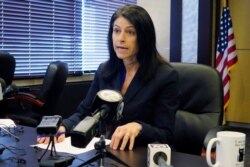 FILE - Michigan Attorney General Dana Nessel speaks during a news conference in Lansing, Mich., March 5, 2020.