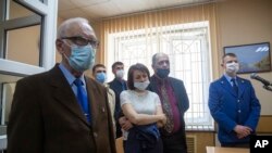 FILE—Members of Jehovah's Witnesses attend a court session in Perm, Russia, on May 12, 2021.