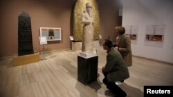 Participants in the Antiquities Protection Workshop look a King Shalmaneser III statue, while learning to counter heritage crimes and trafficking of artifacts, at the Iraqi National Museum in Baghdad, Iraq, Jan. 23, 2019. 