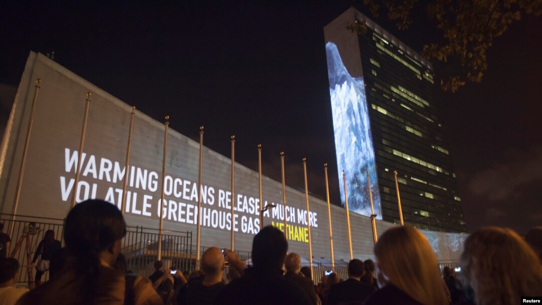 FILE - Messages on methane gas and carbon dioxide emissions are projected onto the United Nations building ahead of the climate change talks that will take place on the sidelines of the U.N. General Assembly, in New York, Sept. 20, 2014. 