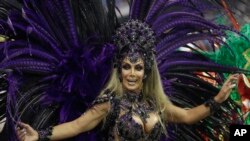 Transgender godmother Camila Prins, representing the Colorado do Bras samba school, performs at Carnival in the Sambadrome in Sao Paulo, Brazil, Feb. 22, 2020.