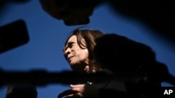 Democratic presidential nominee and Vice President Kamala Harris talks to reporters upon boarding Air Force Two on Oct. 30, 2024, at Joint Base Andrews, Maryland.