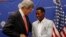 U.S. Secretary of State John Kerry talks to 2013 Boston Marathon winner Lelisa Desisa Bentiin, in Addis Ababa, Ethiopia, May 26, 2013.