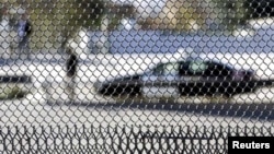 A patrol car is seen through a fence on the US-Mexican border in El Paso, Texas (file photo).