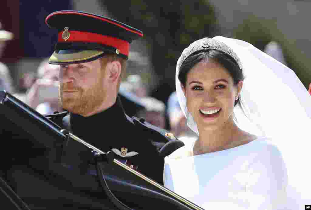 Britain&#39;s Prince Harry and his wife Meghan Markle leave after their wedding ceremony, at St. George&#39;s Chapel in Windsor Castle in Windsor, near London, England, Saturday, May 19, 2018. (Gareth Fuller/pool photo via AP)