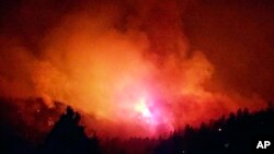 In this photo provided by Inciweb, a wildfire burns near Durango, Colo., June 7, 2018. Authorities welcome widespread rains predicted this weekend across the U.S. Southwest.