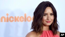 FILE - Demi Lovato arrives at the Kids' Choice Awards at the Galen Center in Los Angeles.