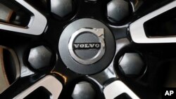 FILE - This is the Volvo logo on a wheel on a 2019 S90 T6 AWD Inscription automobile on display at the 2019 Pittsburgh International Auto Show in Pittsburgh, Feb. 14, 2019